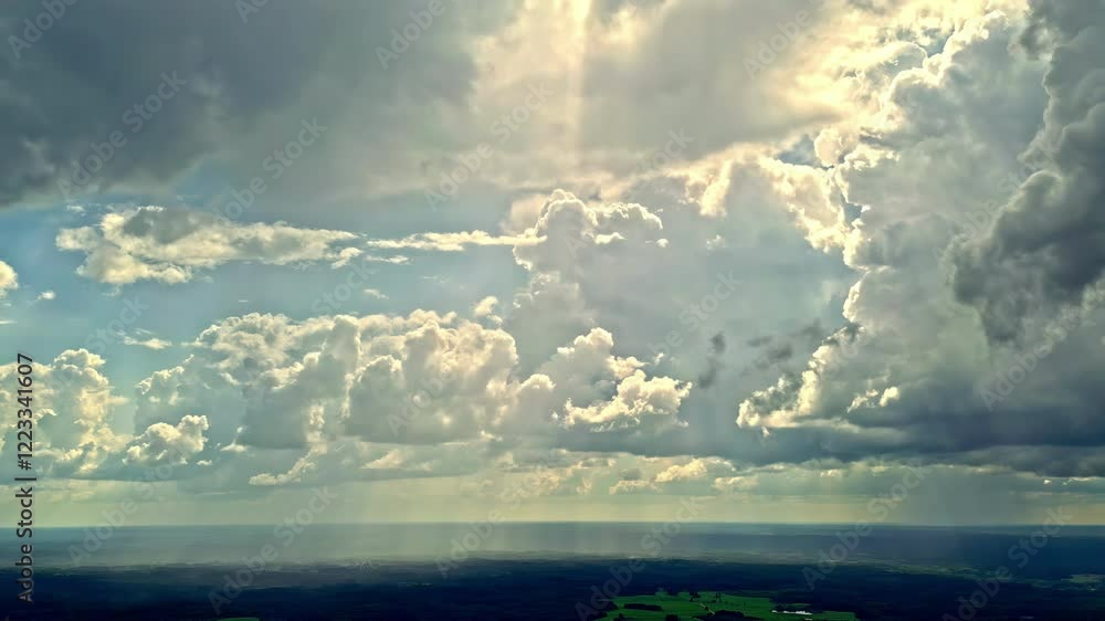 Poster beautiful clouds in the sky moving with the wind and the rays of sunlight passing through the clouds