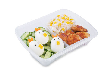 Bento box with rice, fried meat slices, cucumber and eggs in the form of funny chickens on a white isolated background