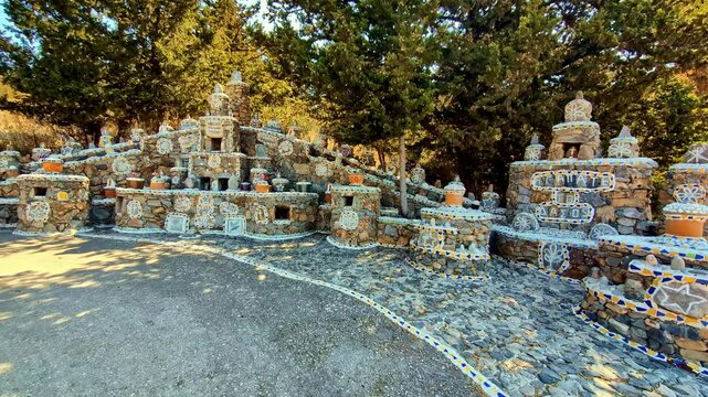Impressive hand-made monuments in the historic village of Kefalas. Handheld panoramic shot