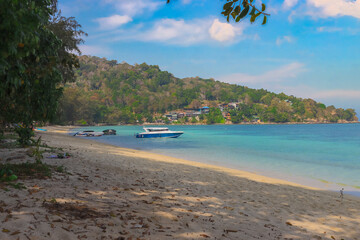 Patong Beach phuket Thailand beautiful turquoise blue waters on the white sand and long tail boats used for tourist 