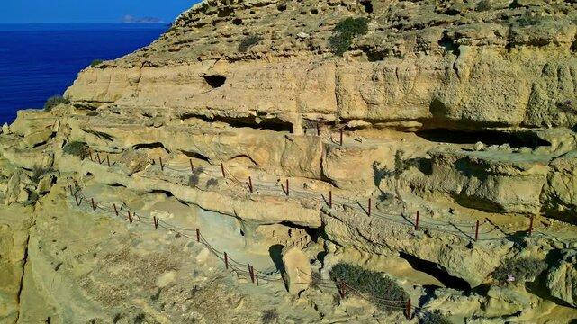 Matala caves, Pitsidia Greece, in sea cliffs from ancient neolithic ages, hippies