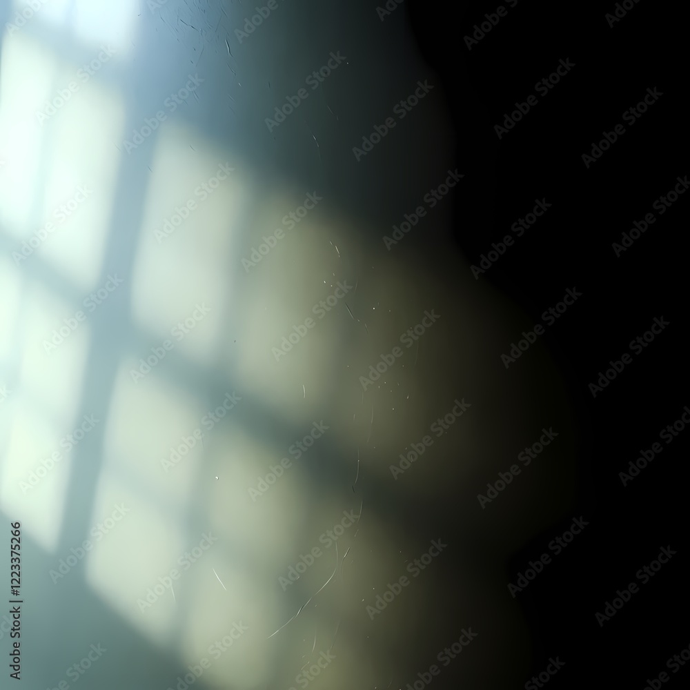 Poster shadows and light create a captivating visual pattern on a wall in a quiet indoor setting during the