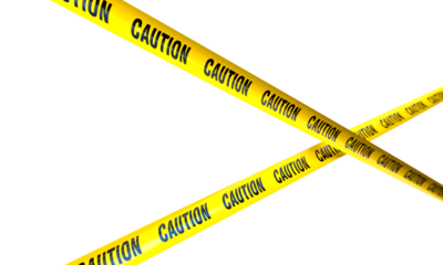 Yellow caution tape crossing on a transparent background