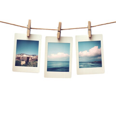 Empty Polaroid photos hanging on a clothesline with clothespins isolated on transparent background