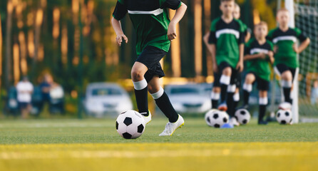 Football Soccer Academy Practice. Young Boys In Training Drills On Grass Pitch. Soccer Players...