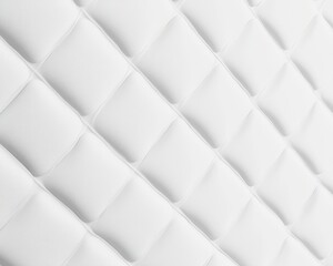 Fototapeta premium A textured white surface with a diamond pattern, showcasing a modern, clean aesthetic suitable for interior design.