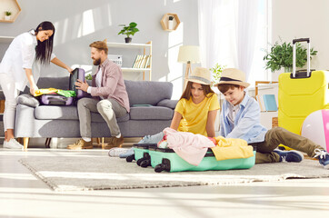 At home, the family with children is busy packing suitcases in preparation for upcoming travel...