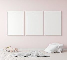 A minimalist interior featuring three empty frames on a light pink wall, with a cozy floor arrangement including cushions and decorative items.