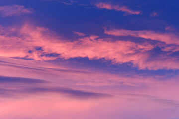 Pink and purple hues paint the sky at sunrise or sunset creating a breathtaking spectacle of color and light