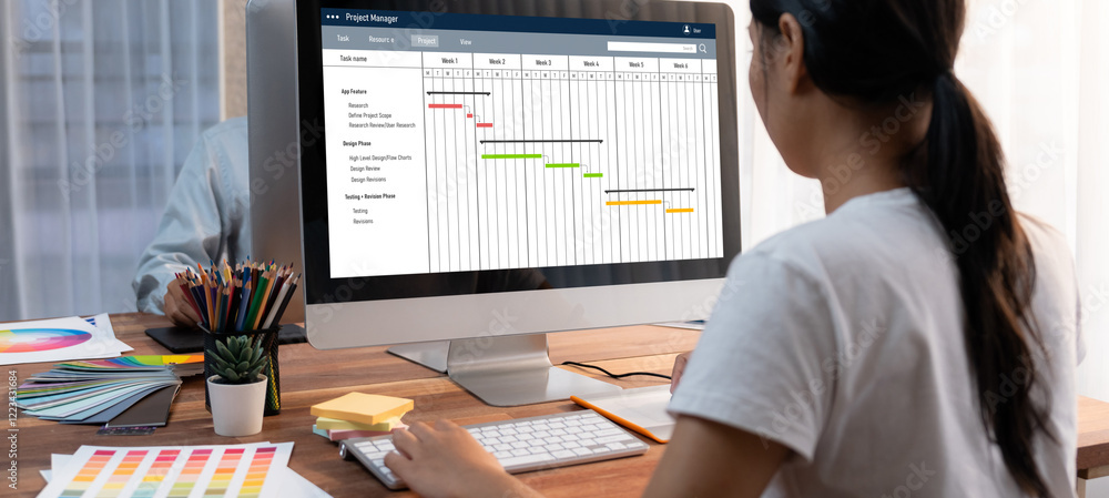 Poster Project planning software for brisk business project management on the computer screen showing timeline chart of the team project