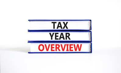Tax year overview symbol. Concept words Tax year overview on beautiful blue white books. Beautiful white background. Business tax year overview concept. Copy space.