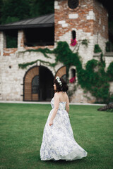 Portrait of stunning bride with long hair posing with great bouquet