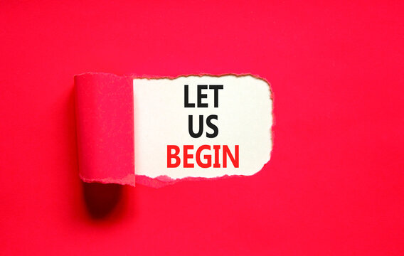Let us begin symbol. Concept words Let us begin on beautiful white paper. Beautiful red table red background. Business motivational let us begin concept. Copy space.
