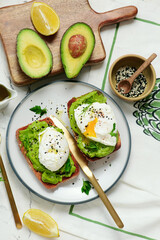 Whole grain toast with avocado and poached egg. for breakfast  .Healthy appetizer.