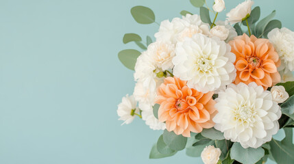 Fototapeta premium Pastel Flower Bouquet with White and Orange Dahlias on Soft Turquoise Background