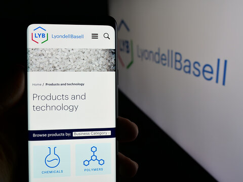 Stuttgart, Germany - 01-24-2025: Person holding smartphone with web page of chemical company LyondellBasell Industries N.V. on screen with logo. Focus on center of phone display.