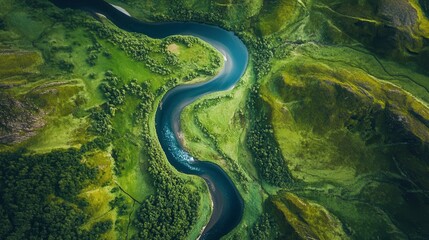Majestic aerial view of serpentine river winding through lush green landscape