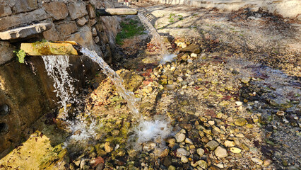 Water fountain troughs, carved from a tree trunk, used for drinking water in the Dokuzoluk Recreation Area of the Taurus Mountains.