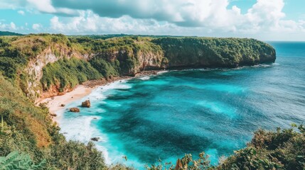 Obraz premium Lush green cliffs embrace a secluded turquoise cove beach