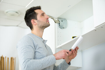 Fototapeta premium kitchen installer at carpenter work