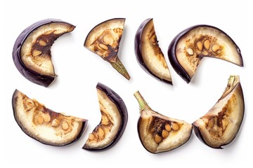 Sliced eggplant arranged artistically on a white background showcasing its inner texture isolated on transparent background