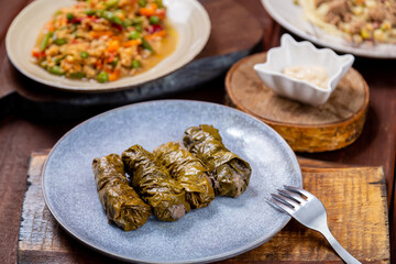 Couscous with vegetables, udon noodles with meat in spices and dolma