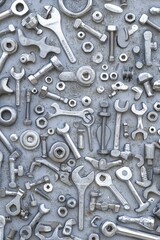 Fototapeta premium Metallic Tools and Fasteners Arranged in a Pattern