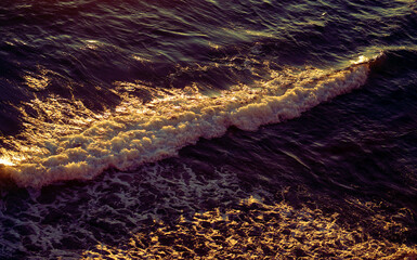 Photos of sea waves moving at sunset