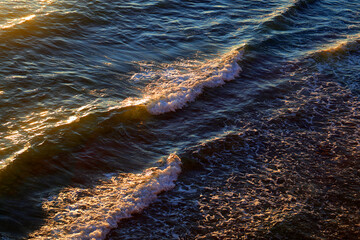 Photos of sea waves moving at sunset