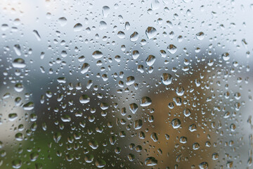 Raindrops on the glass in the window. Wet window after rain. Rain outside the window.