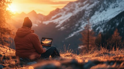 Digital nomad working during sunset in the mountains
