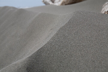 Close up image of ripples in the sand on a beach