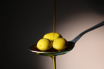 Liquid Gold Olive Oil Beautifully Drizzling Smoothly from a Spoon in Culinary Delight