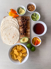 A calming scene showcasing beautifully arranged ingredients, all ready to come together for the perfect taco experience.