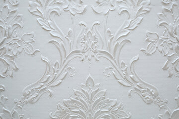 Pattern on a white wall. Texture of patterns on the wall.