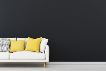 A modern living room scene featuring a white sofa adorned with yellow and patterned pillows, set against a dark wall. The floor is light-colored wood, creating a stylish contrast.
