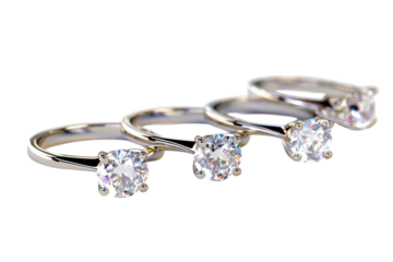 Elegant array of sparkling engagement rings displayed on a soft surface, capturing the beauty of timeless romance and style isolated on transparent background