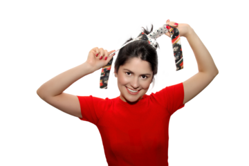 smiling girl playing with her scarf on neutral background