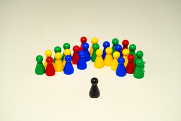 Different colored pawns representing the concept of diversity, selectively focusing on a single...