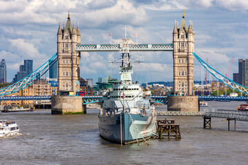 Tower bridge and Belfast warship on Thames river, London, UK