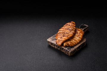 Delicious fresh grilled chicken fillet with spices and herbs