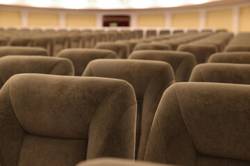 Obraz premium Rows of gray comfortable seats in theatre, closeup