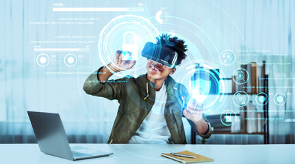 Skilled african man looking at personal data while wearing VR glasses. Person with casual shirt checking and analyzing security protection and accessing firewall protection. Technology. Ingenuity.