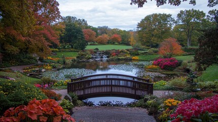 Obraz premium Autumnal garden bridge, pond, colorful foliage, peaceful scene, landscape design