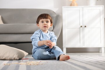 Little boy playing with matches at home. Child in danger