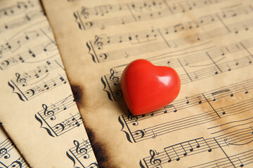 Heart figure on musical note sheets, closeup