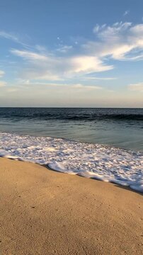 Sandy beach with waves rolling in Boa Vista, Cabo Verde, Africa