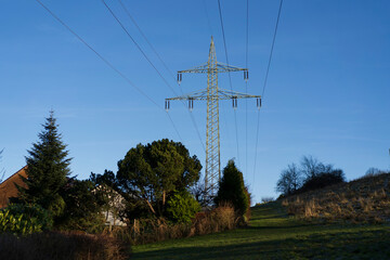 Power lines among trees on an autumn day. Energy concept