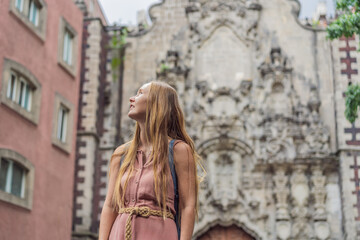 Fototapeta premium Female tourist in the central square of Mexico City, Zocalo. Cultural exploration, travel, and historic architecture concept