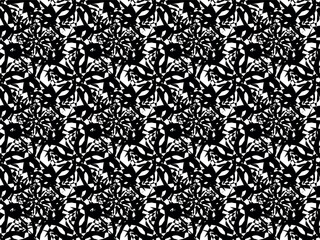 An ornamental black lace design made of abstract lines in the shape of a circle and a flower. Seamless vector pattern for design and decoration .

